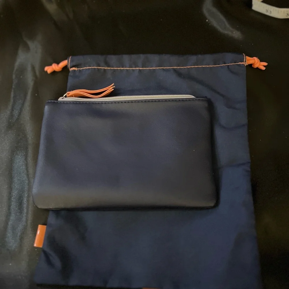 2 Ipsy bags, never used. One is a drawstring cloth bag and the other zips.